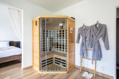 Un ou plusieurs lits dans un hébergement de l'établissement Suite Dreams - Balnéo & Sauna