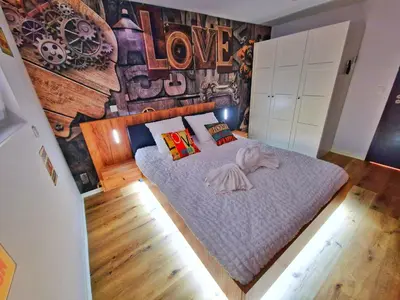 Un ou plusieurs lits dans un hébergement de l'établissement LOFT & SPA-6 Pers-Jacuzzi-Parking-Jardin-Clim-Colmar