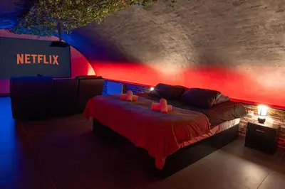 Un ou plusieurs lits dans un hébergement de l'établissement L'escapade Vosgienne, Cinéma, Balnéo