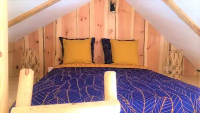 Un ou plusieurs lits dans un hébergement de l'établissement chalet dans la ville