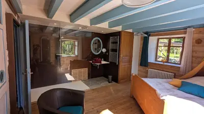 Coin salon dans l'établissement Le Chalet Vosges Montagne