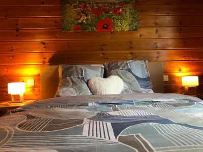 Un ou plusieurs lits dans un hébergement de l'établissement Le chalet du Hibou