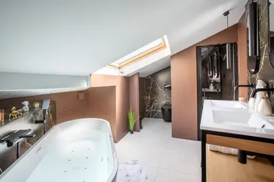 Un ou plusieurs lits dans un hébergement de l'établissement Suite Choco Love and SPA