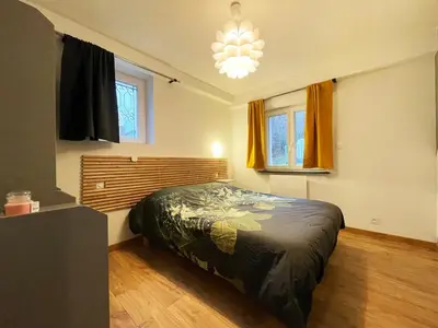 Un ou plusieurs lits dans un hébergement de l'établissement appartement cosy