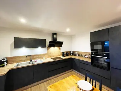 Cuisine ou kitchenette dans l'établissement appartement cosy