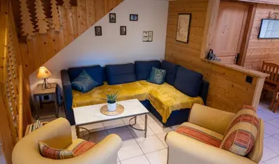 Coin salon dans l'établissement Perce Neige Bien être