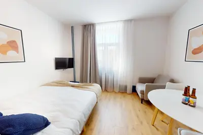 Télévision ou salle de divertissement dans l'établissement Résidence CoLiving Porte de France - Self Check In by Homenhancement