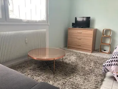 Télévision ou salle de divertissement dans l'établissement Petit appartement cosy