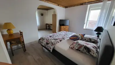 Un ou plusieurs lits dans un hébergement de l'établissement Suite Cosy Deluxe 