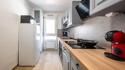 Cuisine ou kitchenette dans l'établissement BEAUSÉJOUR Appart - HYPER CENTRE VILLE