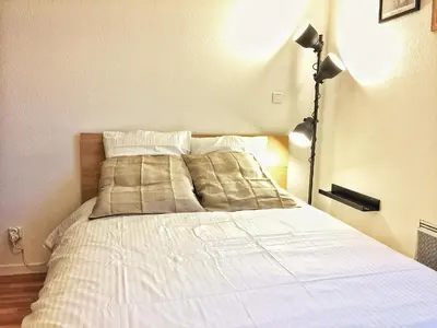 Un ou plusieurs lits dans un hébergement de l'établissement Le Cozy Fonderie