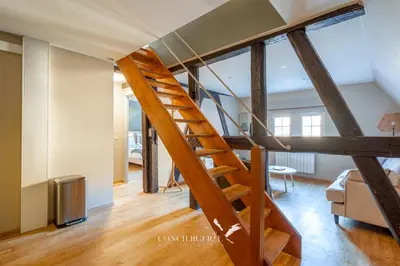 Un ou plusieurs lits dans un hébergement de l'établissement Pistachio Duplex Apartment - Hypercentre Colmar