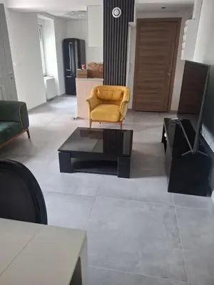 Coin salon dans l'établissement Appartement T3 neuf