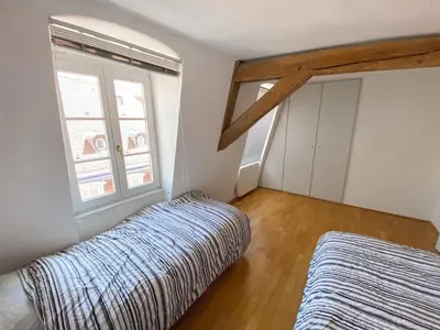 Un ou plusieurs lits dans un hébergement de l'établissement Colmar Attic Duplex
