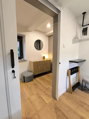 Télévision ou salle de divertissement dans l'établissement Gîte Au Pied Des Vignes