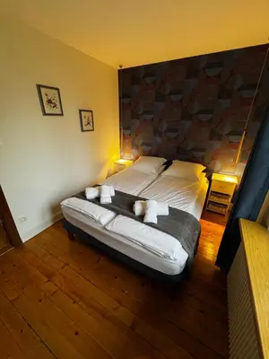 Un ou plusieurs lits dans un hébergement de l'établissement Just In Colmar, maison complète avec parking privé