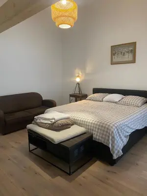 Un ou plusieurs lits dans un hébergement de l'établissement Maison Colmar, spacieuse, accueillante , confortable au calme