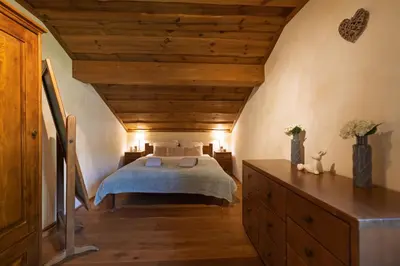 Un ou plusieurs lits dans un hébergement de l'établissement Chalet Les Lucioles, La Bresse 14p - SPA