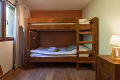 Un ou plusieurs lits dans un hébergement de l'établissement Chalet Les Lucioles, La Bresse 14p - SPA