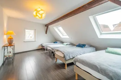 Un ou plusieurs lits dans un hébergement de l'établissement Typical Alsace house - ideal for groups and families