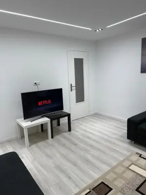 Télévision ou salle de divertissement dans l'établissement Appartement Lumière