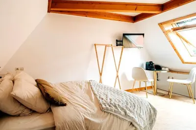 Un ou plusieurs lits dans un hébergement de l'établissement Chai d'oeuvre