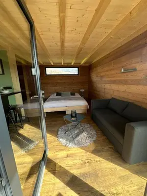 Un ou plusieurs lits dans un hébergement de l'établissement Lodge with private spa