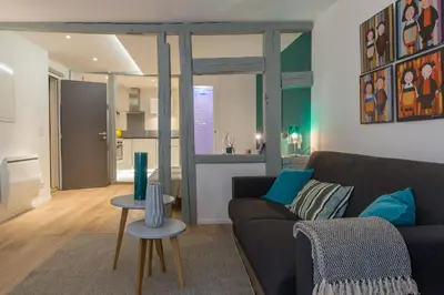 Coin salon dans l'établissement Grand studio Colmar Centre