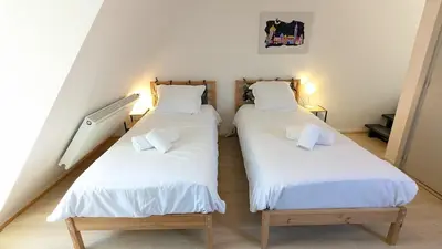 Un ou plusieurs lits dans un hébergement de l'établissement Le Refuge - Petite maison de village
