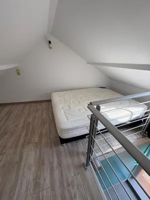 Un ou plusieurs lits dans un hébergement de l'établissement Charmant duplex aux portes de Belfort