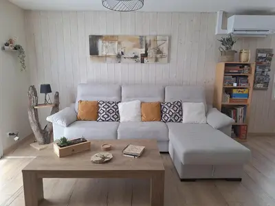 Coin salon dans l'établissement Maison Dom&Sy - Détente & Loisirs à Bussang avec sauna et salle de jeux