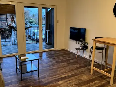 Télévision ou salle de divertissement dans l'établissement Studio lumineux avec terrasse