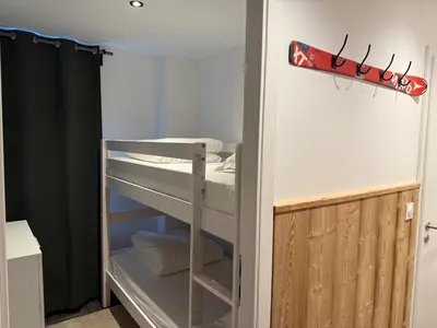 Un ou plusieurs lits dans un hébergement de l'établissement Appartement cosy en plein centre de Gérardmer