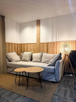 Coin salon dans l'établissement Appartement cosy en plein centre de Gérardmer