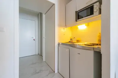 Cuisine ou kitchenette dans l'établissement Magnifique Studio Mulhouse Centre