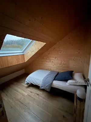 Un ou plusieurs lits dans un hébergement de l'établissement Le Chalet des Vosges