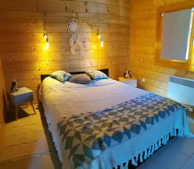Un ou plusieurs lits dans un hébergement de l'établissement Chalet L' Aventurière