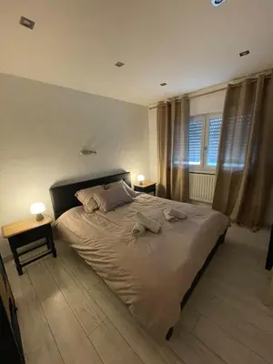 Un ou plusieurs lits dans un hébergement de l'établissement Cozy house with garden
