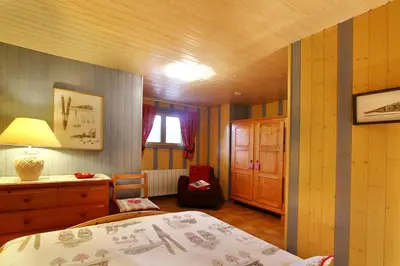 Un ou plusieurs lits dans un hébergement de l'établissement Chalet exposition sud le Nid Douillet