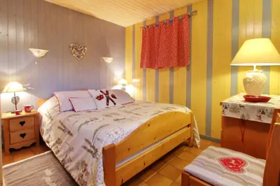 Un ou plusieurs lits dans un hébergement de l'établissement Chalet exposition sud le Nid Douillet