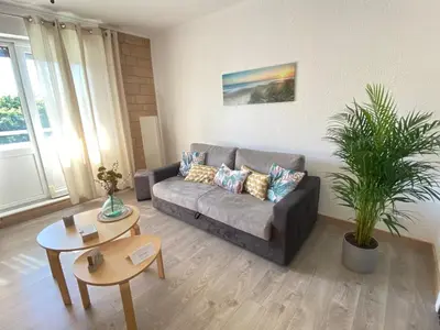 Coin salon dans l'établissement Expérience unique Explorer 3 pays depuis le même logement