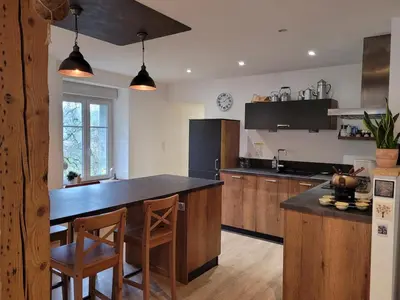 Cuisine ou kitchenette dans l'établissement Gîte cosy dans les Vosges