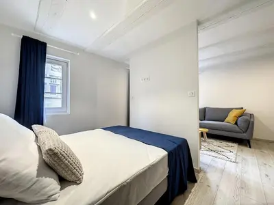 Un ou plusieurs lits dans un hébergement de l'établissement La Grenouillere Chic Appartement Centre Colmar