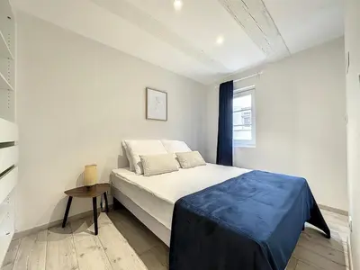 Un ou plusieurs lits dans un hébergement de l'établissement La Grenouillere Chic Appartement Centre Colmar
