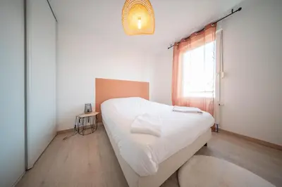 Un ou plusieurs lits dans un hébergement de l'établissement Bord du Canal 134 Logement Terrasse Mulhouse