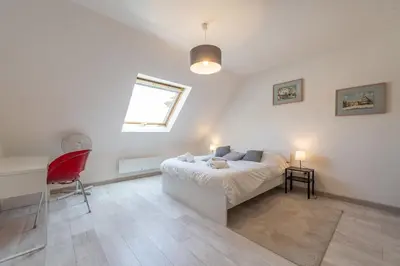 Un ou plusieurs lits dans un hébergement de l'établissement Bel appartement au centre Colmar stationnement