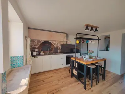 Cuisine ou kitchenette dans l'établissement Le Repaire de la Chouette