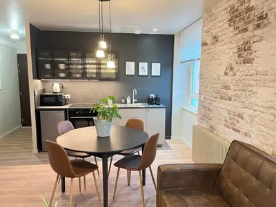 Cuisine ou kitchenette dans l'établissement Votre séjour lumière & cocon - Le Clair Obscur