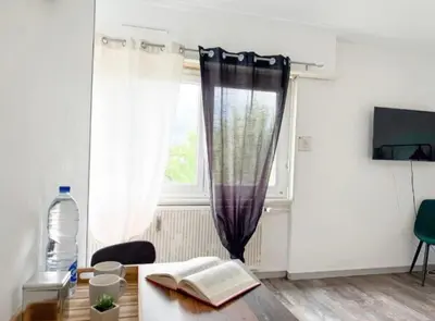 Télévision ou salle de divertissement dans l'établissement Studio des Trois Frontières