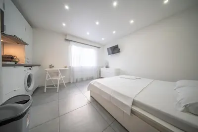 Un ou plusieurs lits dans un hébergement de l'établissement appartement à proximité de bâle avec accès tram et wifi